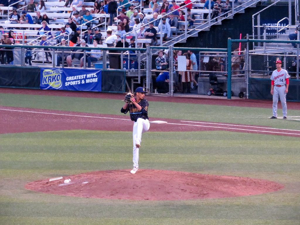 Everett AquaSox right-handed pitcher Deivy Florido preparing to throw a pitch.